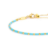 Bracciale con perline a tubo turchesi ed ematite