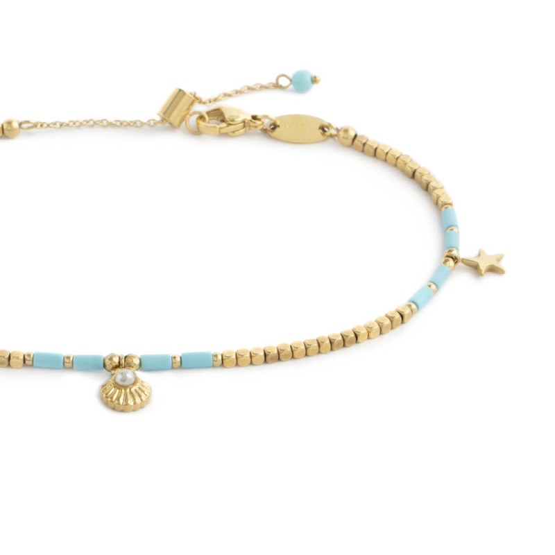 Cavigliera con ematite cubica alternata a perline conchiglia e stelle marine pendenti