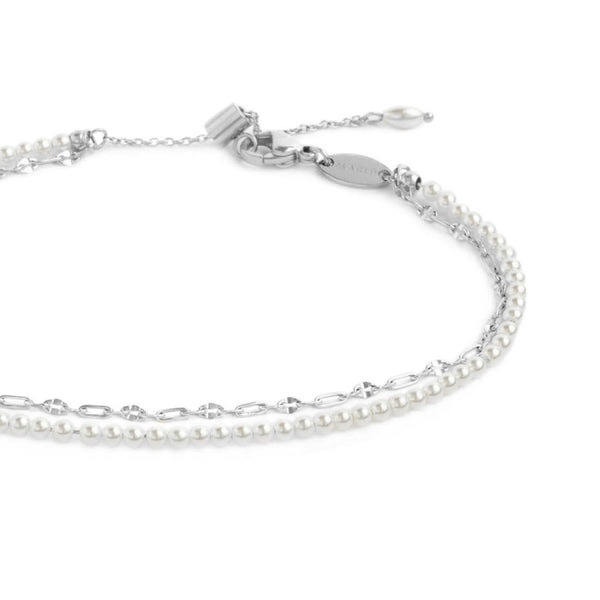Cavigliera doppia catena con perle bianche e lip-cable